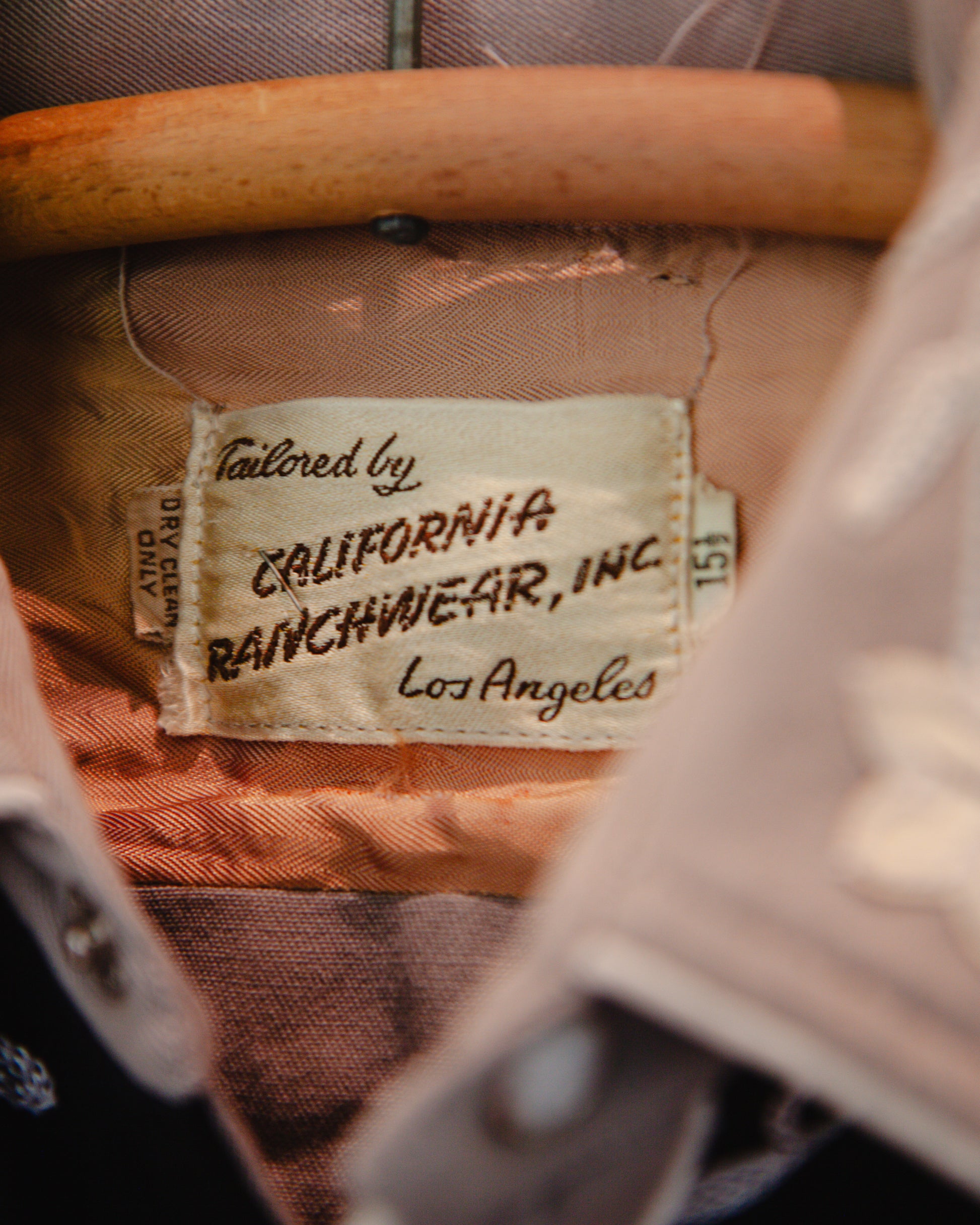 Label on a piece of clothing with 'Tailored by California Ranchwear, Inc. Los Angeles' text.
