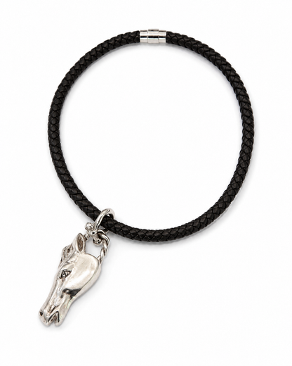 Black braided cord bracelet with a silver horse head charm on a white background