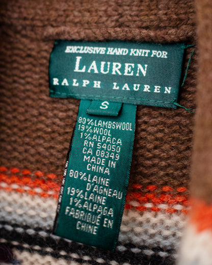 Close-up of a Lauren Ralph Lauren knit garment showing the green hand-knit label and the knit fabric composition.