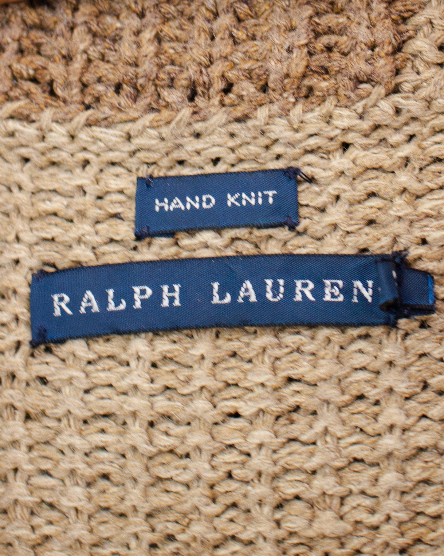Blue RALPH LAUREN label on brown knit garment with hand knit tag.