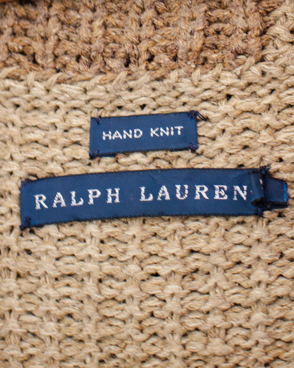 Blue RALPH LAUREN label on brown knit garment with hand knit tag.