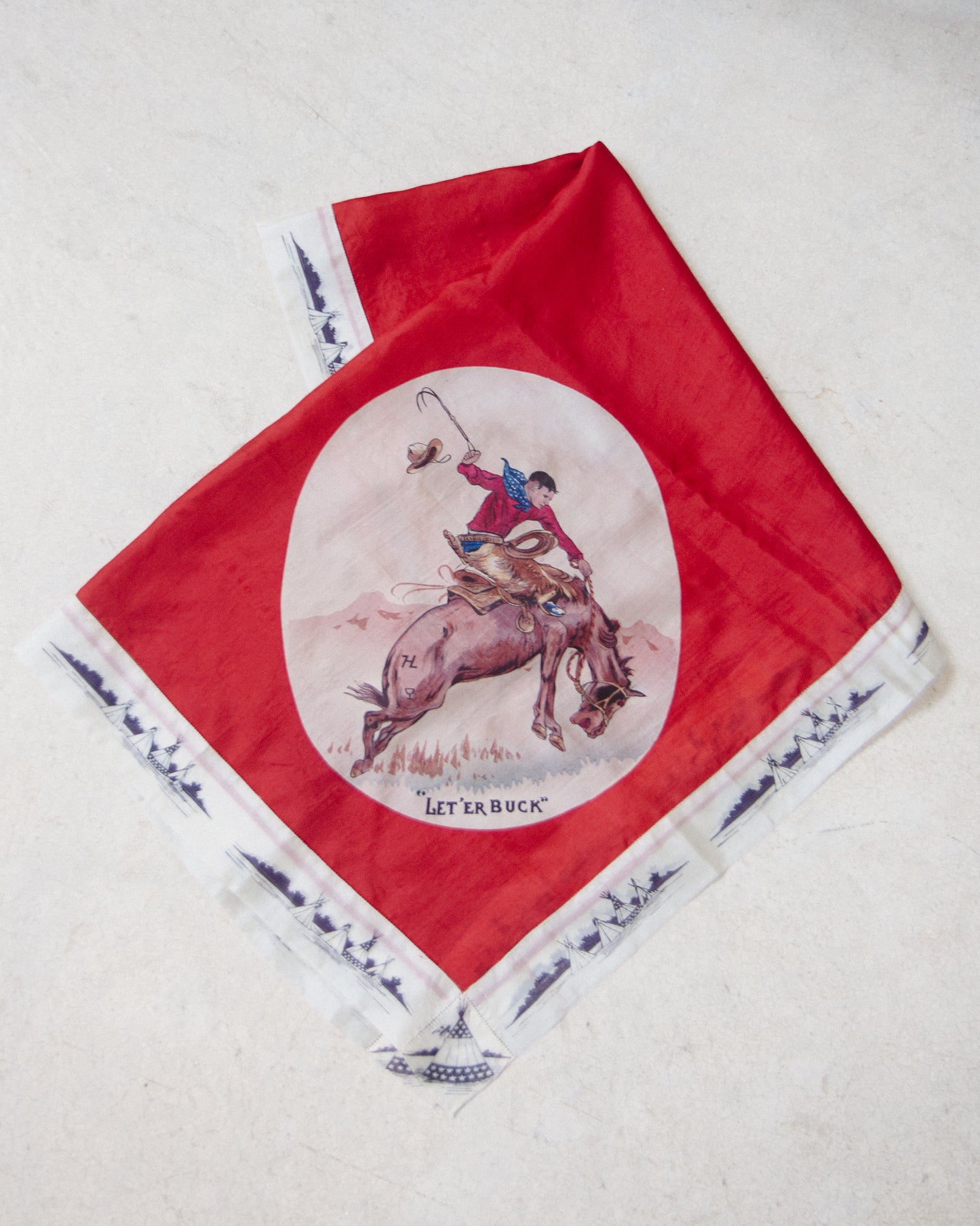 Vintage western-themed scarf featuring a cowboy riding a bucking horse, with the text "LET'ER BUCK" printed below the illustration. The scarf has a bold red border and a white lower section with dark blue ship illustrations.